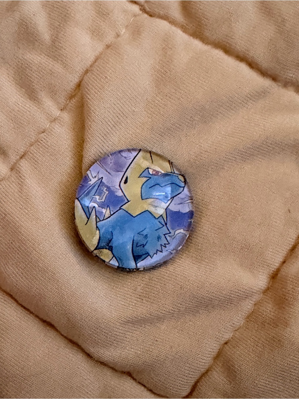 Pokemon Tan Puffer Jacket with Blue Character Button